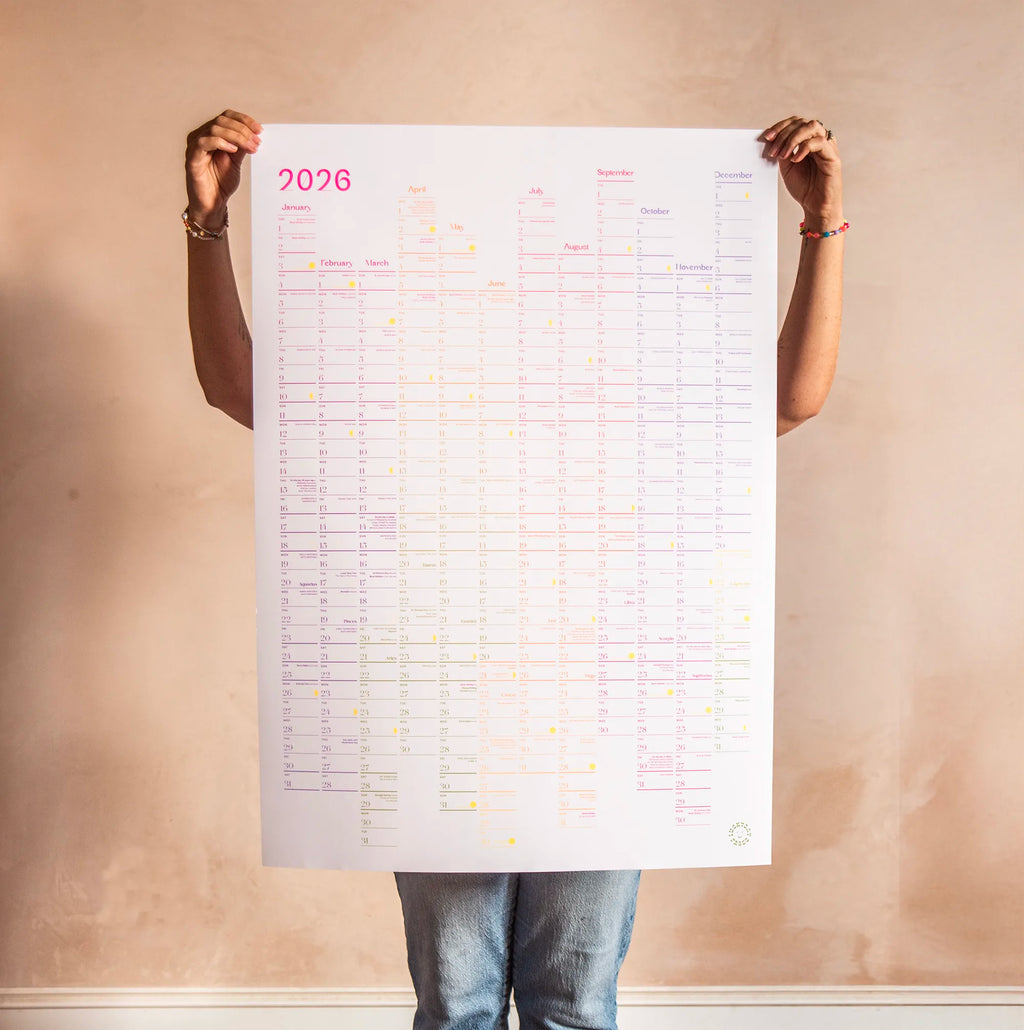Person holding a large 2026 calendar against a plain wall. Luckyday Press Classic all Planner Ladyland press