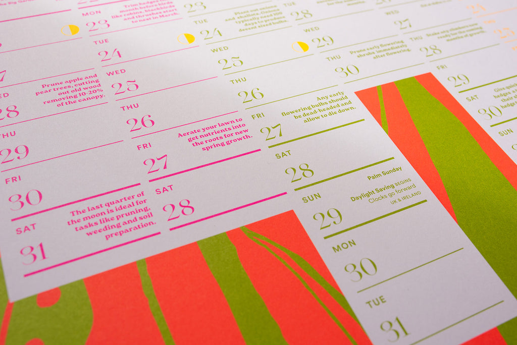 Close up of 2026 wall calendar with colorful design on a white background